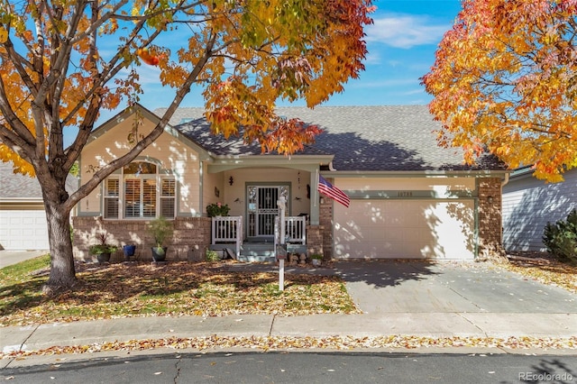 view of front of property featuring a porch and a garage