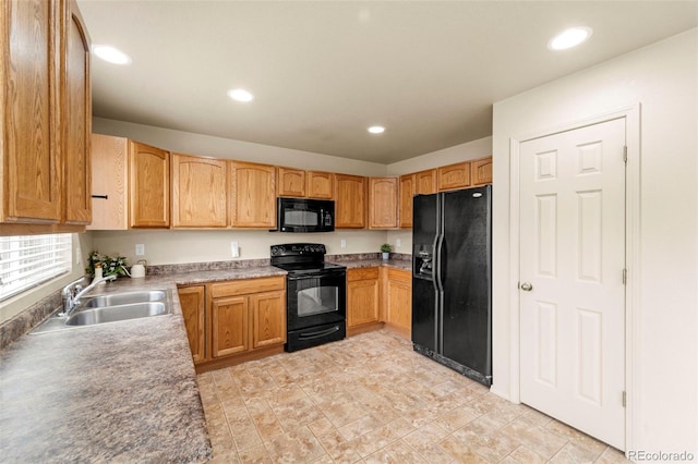 kitchen featuring black appliances, a sink, recessed lighting, and light countertops