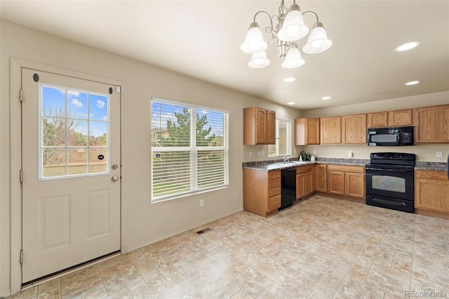 kitchen with black appliances, a chandelier, recessed lighting, a sink, and baseboards