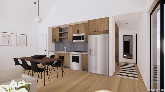 kitchen with brown cabinets, light wood finished floors, open shelves, light countertops, and white appliances