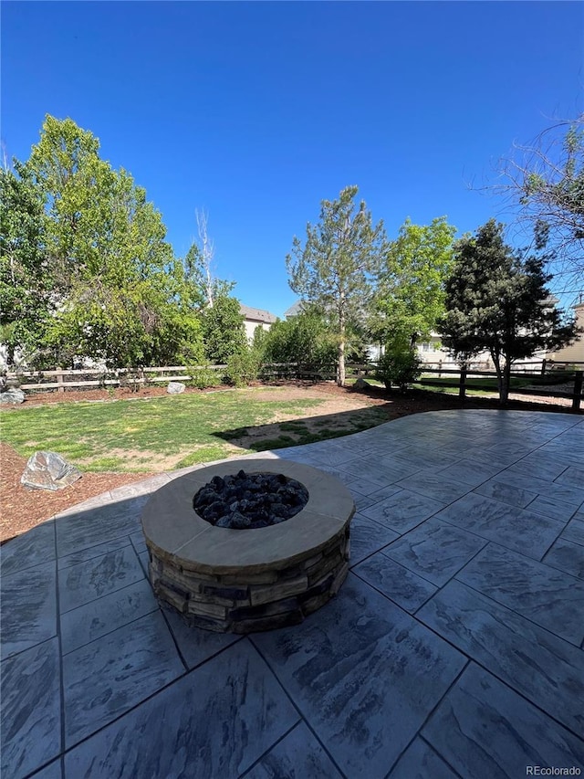 view of patio featuring a fire pit