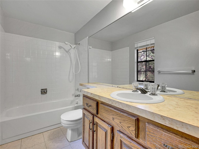 bathroom with tile patterned floors, shower / bathing tub combination, vanity, and toilet
