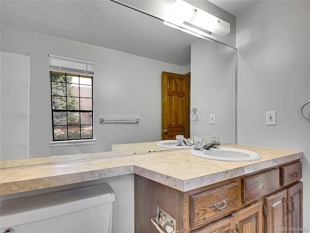 bathroom with vanity and toilet