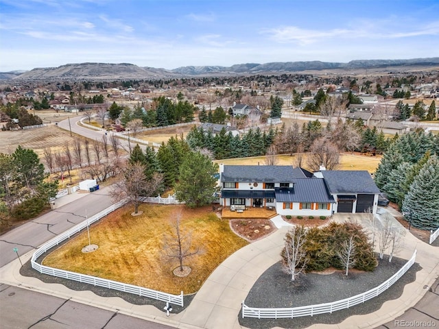 birds eye view of property featuring a mountain view