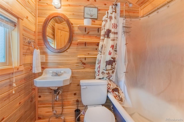 1450 Pine Ln Unit A, Grand Lake, CO 80447 - bathroom with toilet, wooden walls, and shower / bath combo