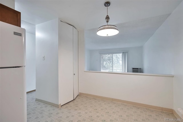 hall featuring baseboards