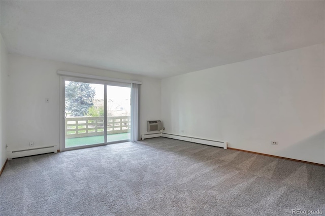 spare room featuring a baseboard radiator, carpet, baseboards, and a baseboard heating unit