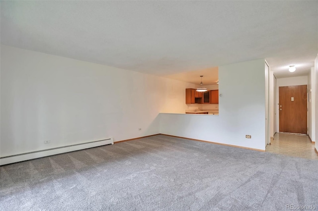 unfurnished room featuring light colored carpet, baseboards, and baseboard heating