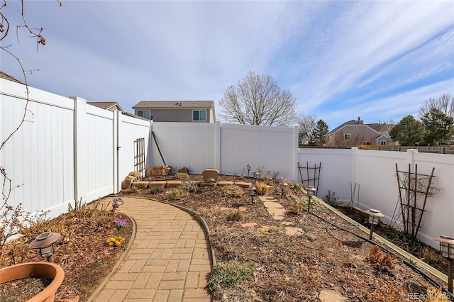 view of yard featuring a fenced backyard