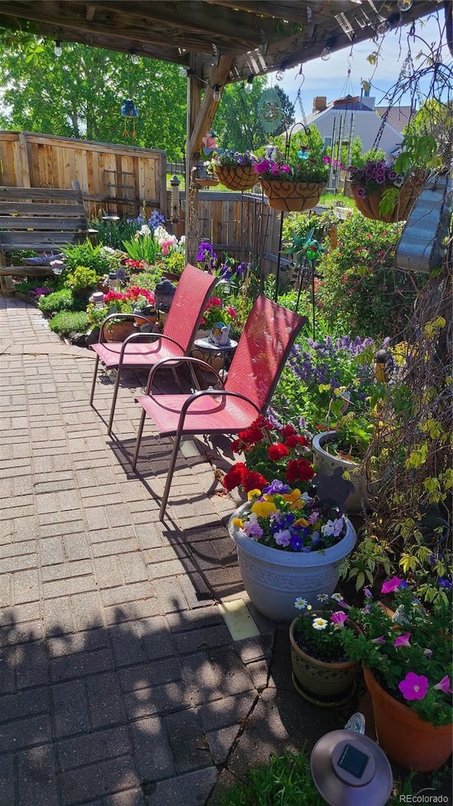 view of patio featuring fence