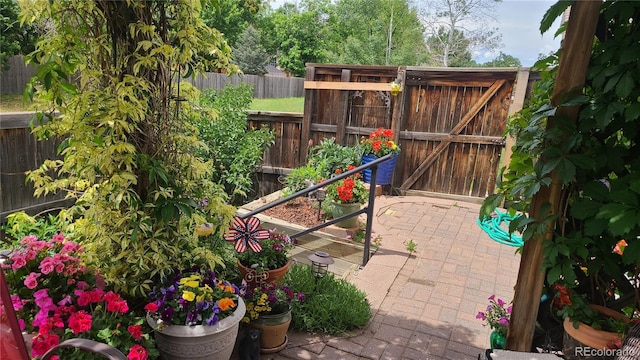 view of patio / terrace featuring a gate and fence