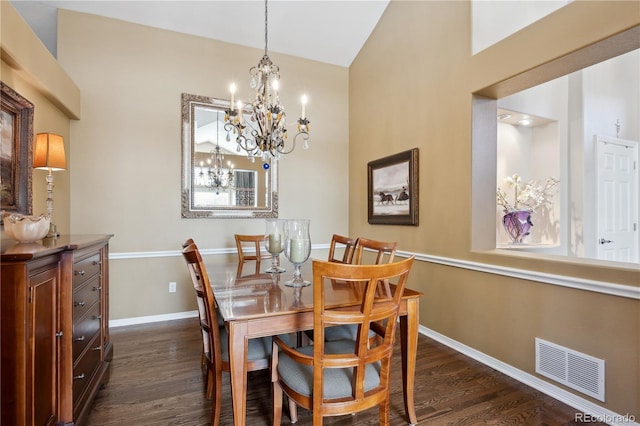 dining room featuring an inviting chandelier, baseboards, visible vents, and dark wood-style flooring