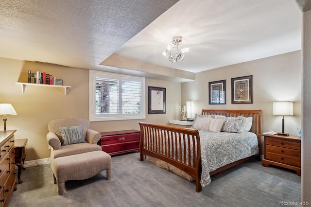 bedroom featuring carpet floors, baseboards, a chandelier, and a textured ceiling