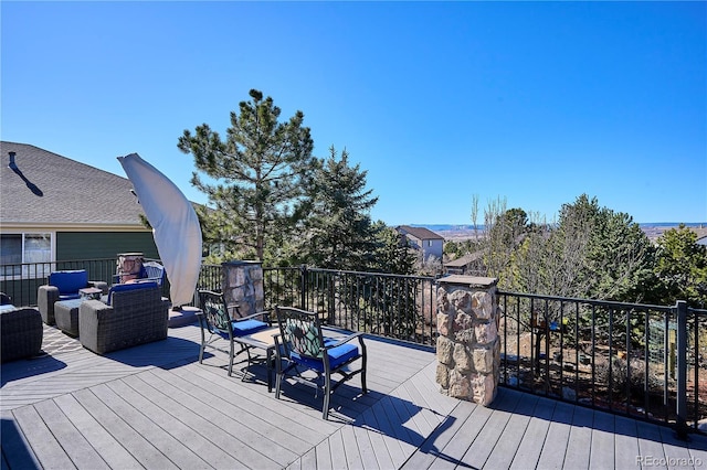 wooden deck with an outdoor hangout area