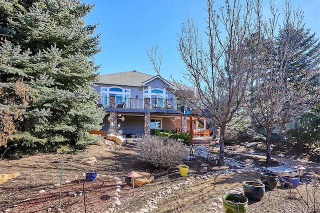 rear view of house with a deck