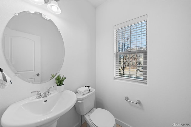 bathroom featuring toilet and sink