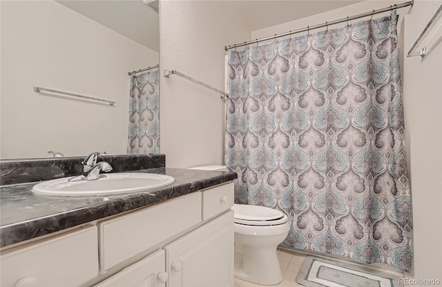 full bath featuring toilet, tile patterned floors, vanity, and curtained shower