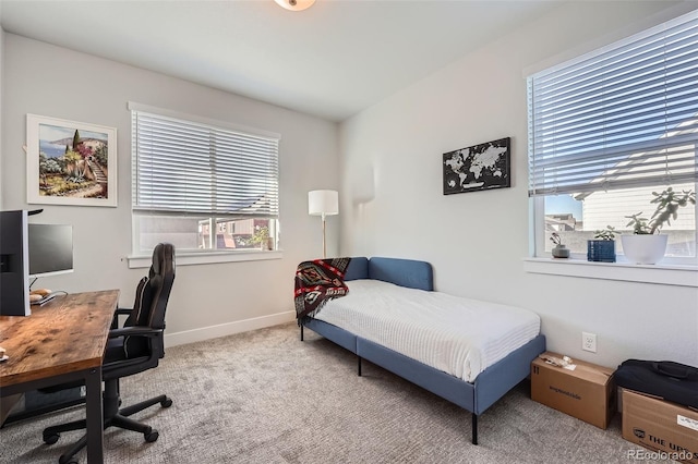 bedroom featuring carpet flooring and multiple windows