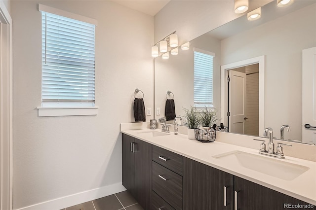 bathroom featuring tile patterned flooring, plenty of natural light, and vanity