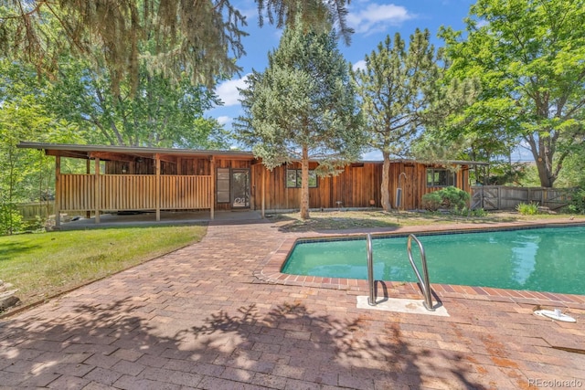 1 Lindenwood Dr, Littleton, CO 80120 - view of swimming pool featuring a fenced backyard and a patio