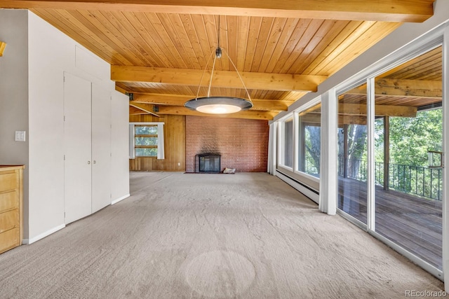 1 Lindenwood Dr, Littleton, CO 80120 - unfurnished living room featuring carpet floors, plenty of natural light, a baseboard radiator, a wooden ceiling with exposed beams, and wood walls