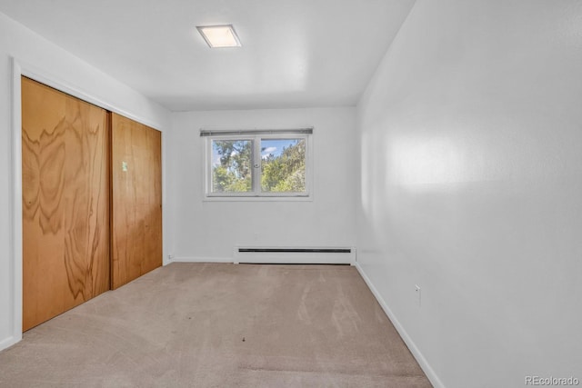 1 Lindenwood Dr, Littleton, CO 80120 - unfurnished bedroom featuring a baseboard radiator, carpet floors, and a closet