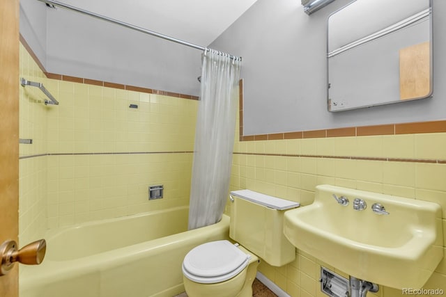 1 Lindenwood Dr, Littleton, CO 80120 - bathroom with shower / bath combo with shower curtain, tile walls, and a wainscoted wall