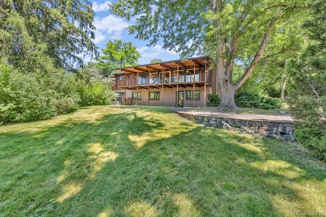 1 Lindenwood Dr, Littleton, CO 80120 - rear view of house featuring a lawn and a wooden deck