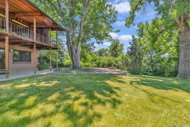 1 Lindenwood Dr, Littleton, CO 80120 - view of green lawn with a patio area