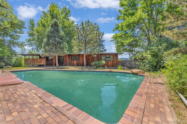 1 Lindenwood Dr, Littleton, CO 80120 - view of swimming pool featuring a fenced backyard