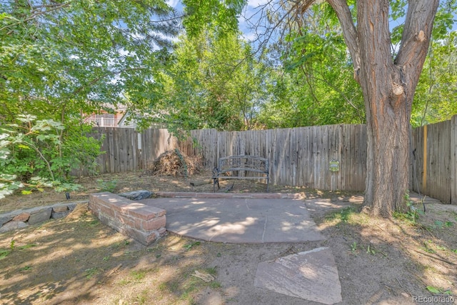 1 Lindenwood Dr, Littleton, CO 80120 - fenced backyard featuring a patio