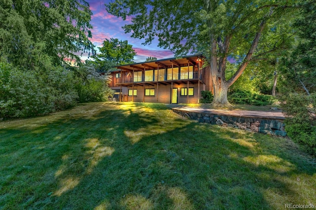 1 Lindenwood Dr, Littleton, CO 80120 - rear view of house with a lawn and a deck