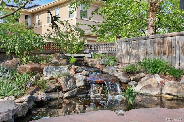 8029 E 23rd Ave, Denver, CO 80238 - view of yard featuring a garden pond