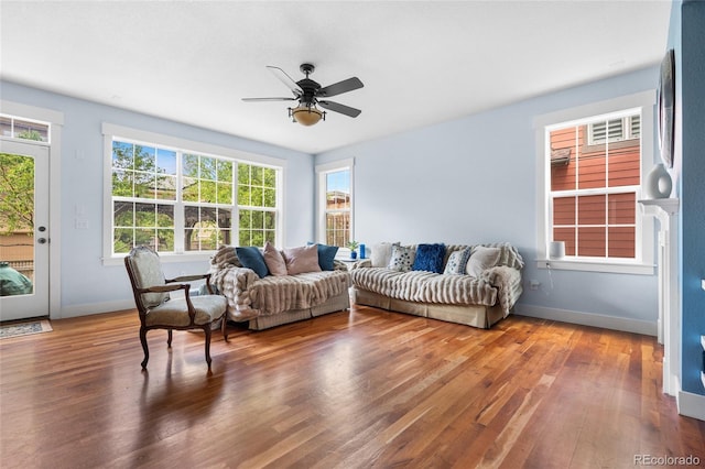 8029 E 23rd Ave, Denver, CO 80238 - living area featuring wood finished floors, a ceiling fan, and baseboards