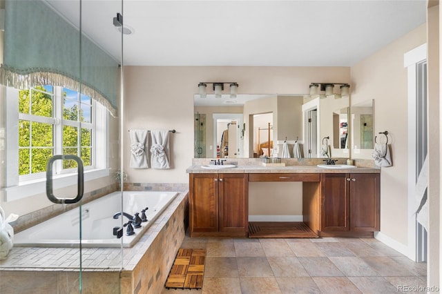 8029 E 23rd Ave, Denver, CO 80238 - full bath featuring double vanity, a bath, and baseboards
