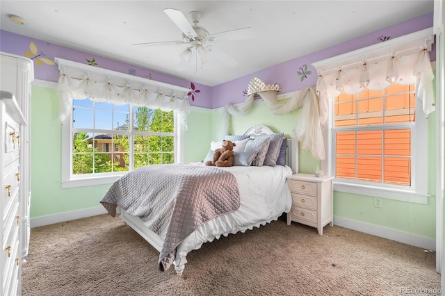 8029 E 23rd Ave, Denver, CO 80238 - bedroom featuring baseboards, light carpet, and a ceiling fan