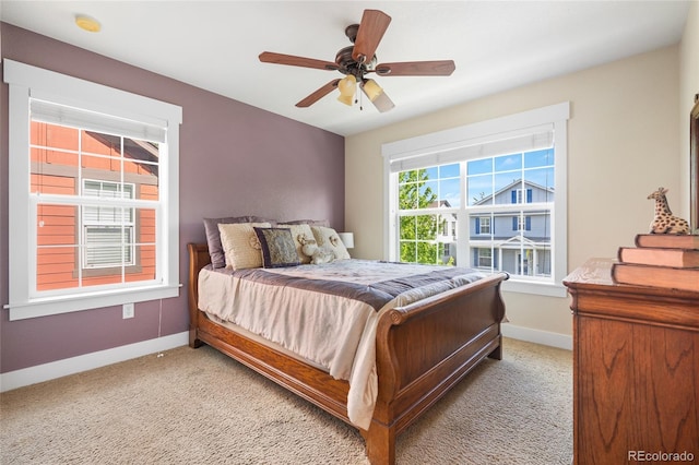 8029 E 23rd Ave, Denver, CO 80238 - bedroom featuring light colored carpet, baseboards, and a ceiling fan