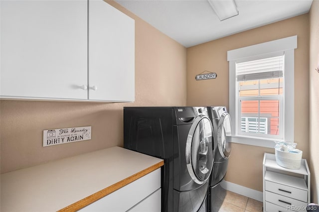 8029 E 23rd Ave, Denver, CO 80238 - washroom with separate washer and dryer, cabinet space, light tile patterned floors, and baseboards