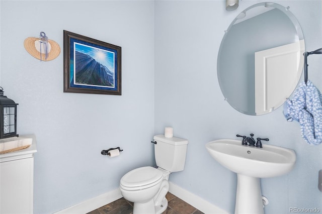 8029 E 23rd Ave, Denver, CO 80238 - bathroom with toilet and baseboards