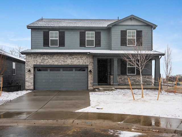 view of front of house with stone siding, a porch, an attached garage, and concrete driveway