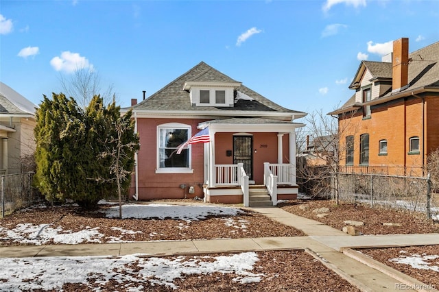 view of front of property featuring covered porch