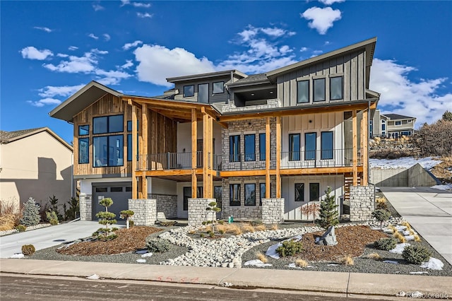 contemporary home with a garage and a balcony