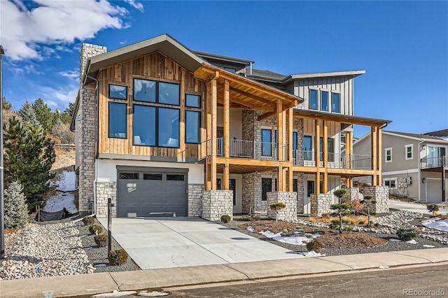 contemporary home featuring a balcony and a garage