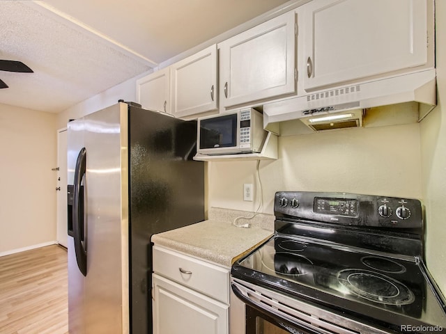 1200 Golden Cir Unit 412, Golden, CO 80401 - kitchen with black range with electric stovetop, stainless steel fridge with ice dispenser, under cabinet range hood, light countertops, and light wood finished floors
