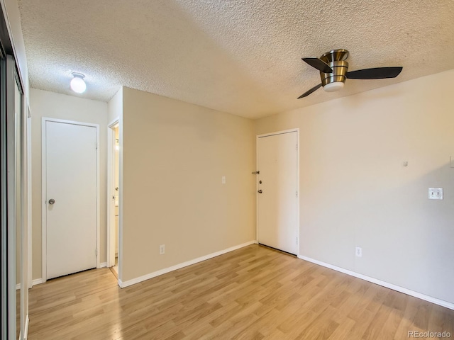 1200 Golden Cir Unit 412, Golden, CO 80401 - unfurnished room with light wood-style floors, a textured ceiling, and a ceiling fan