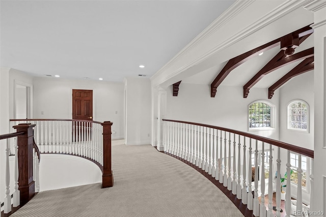 corridor featuring light colored carpet and vaulted ceiling with beams