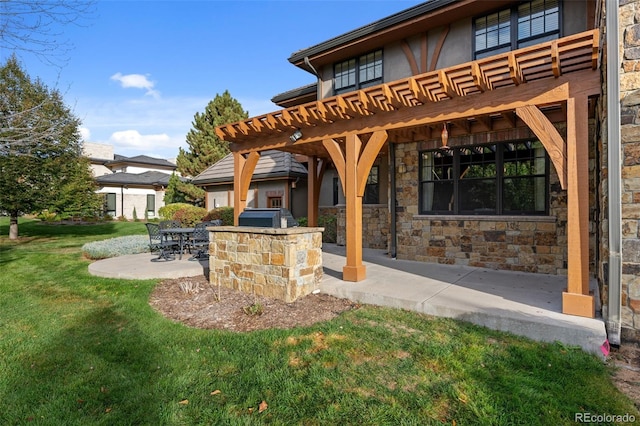 view of patio featuring an outdoor kitchen, grilling area, and a pergola