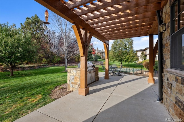 view of patio / terrace featuring area for grilling and a pergola