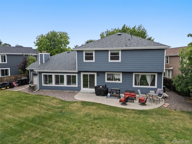 5552 S Lisbon Ln, Centennial, CO 80015 - back of house featuring a chimney, a patio, and roof with shingles