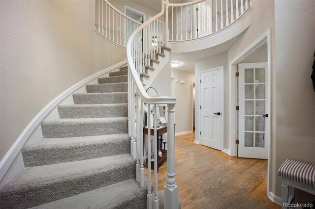 5552 S Lisbon Ln, Centennial, CO 80015 - stairs with wood finished floors and a towering ceiling